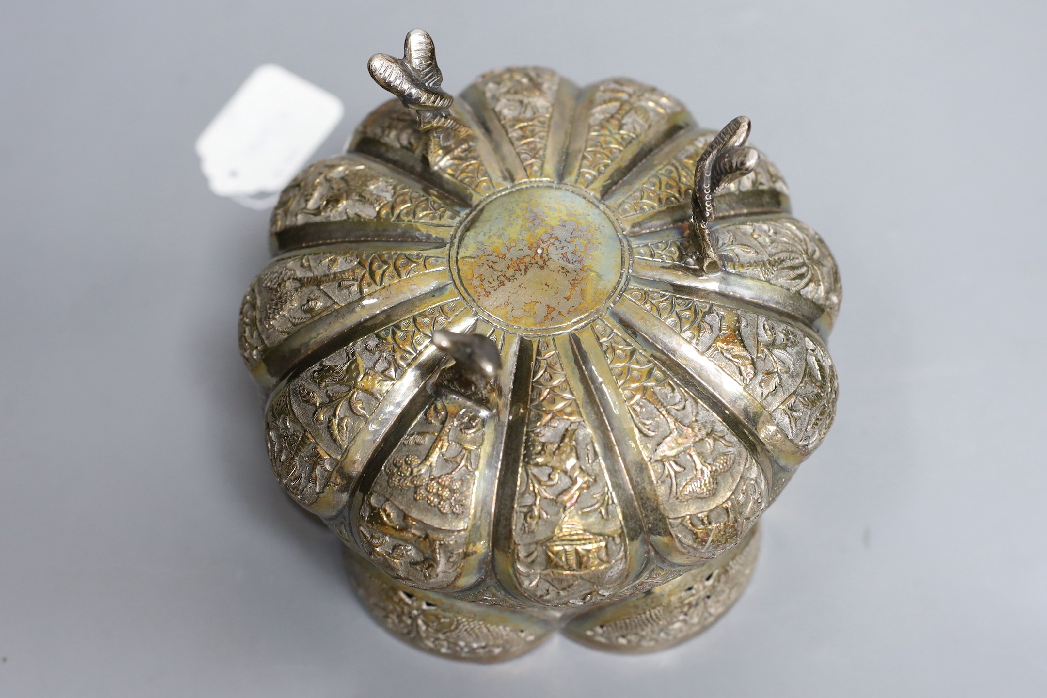 An Indian embossed white metal bowl, on three entwined serpent feet, diameter 17.5cm, 13.9oz.